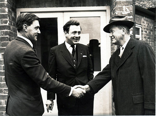 One of the first moves outside the United States was to the UK where Robert Cobb snr (right) is pictured being greeted by Peter Beck (left) and John Knowles, who set up the Cobb Breeding Company and began developing international business in the 1960s. 